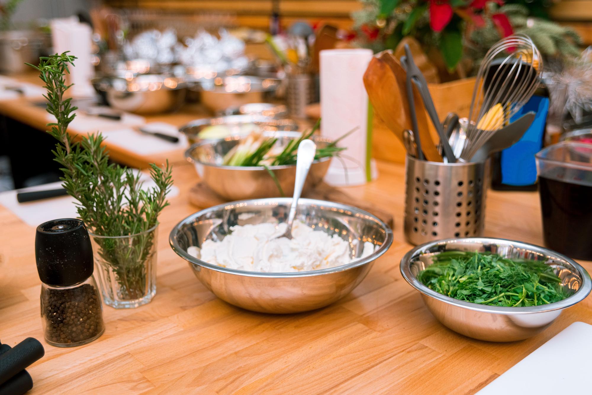 Open kitchen workspace with utensils and herbs